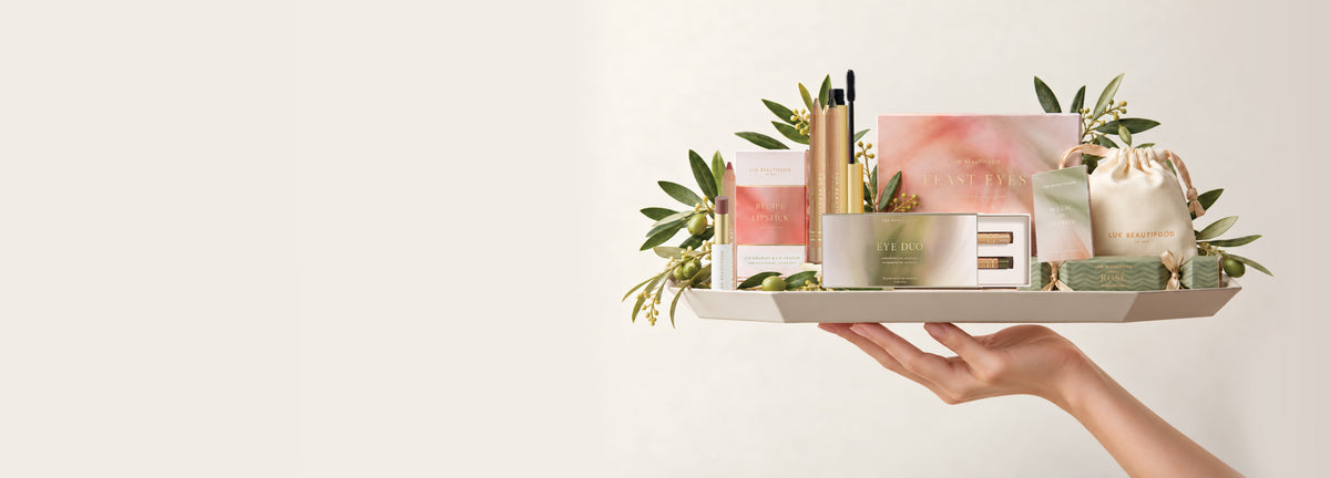 Lük Beautifood limited edition holiday makeup gift sets served on a tray, including Feast for Your Eyes, an Eye Duo, Recipe of a Lipstick and Christmas bon bons