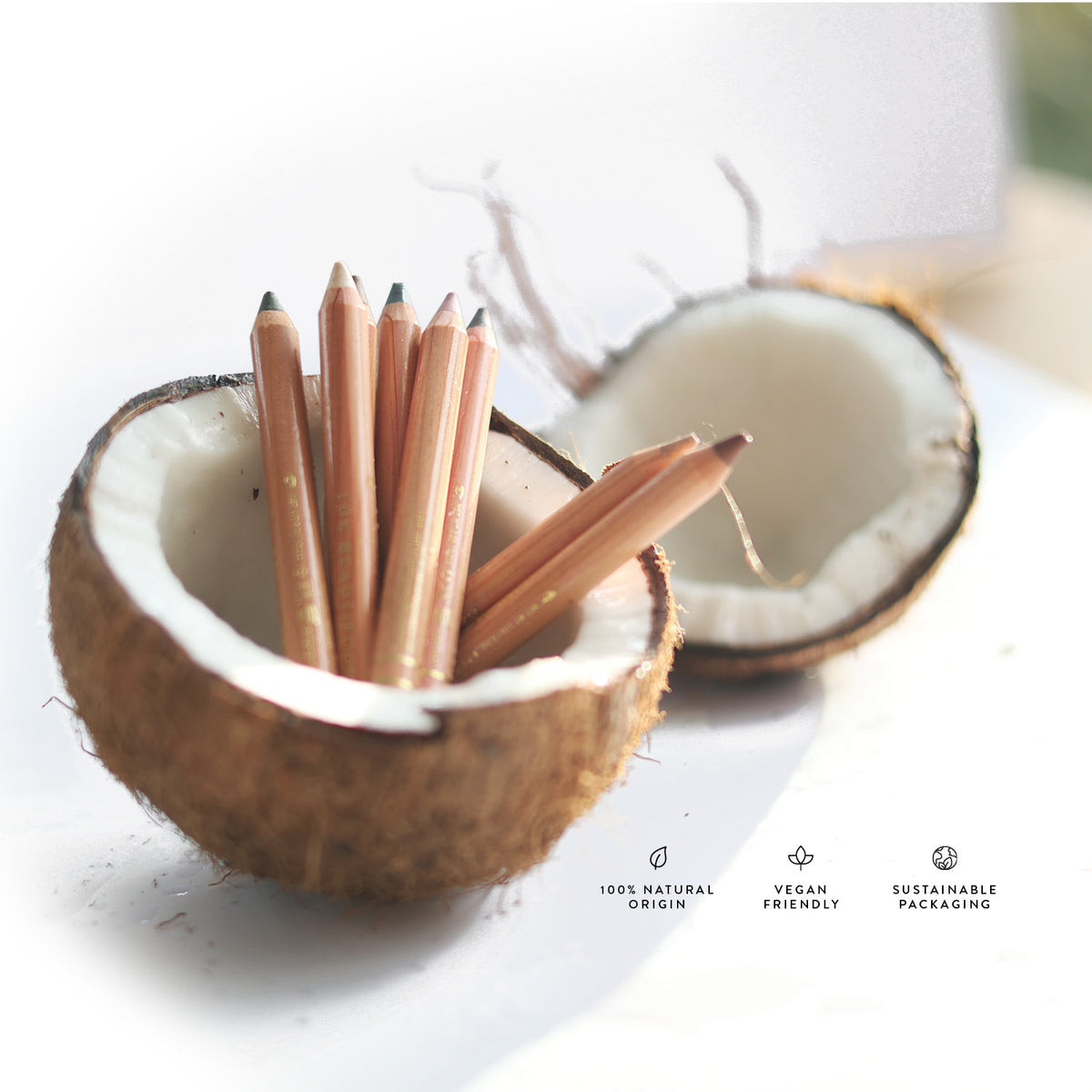 Lük Beautifood Luminous Eye Crayon pencils in a halved coconut