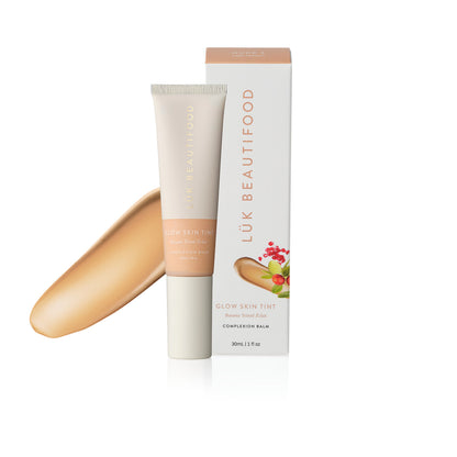 LÜK Beautifood Instant Glow Skin Tint in Nude 3 Light Medium, tube and box with a swatch of the tinted complexion balm