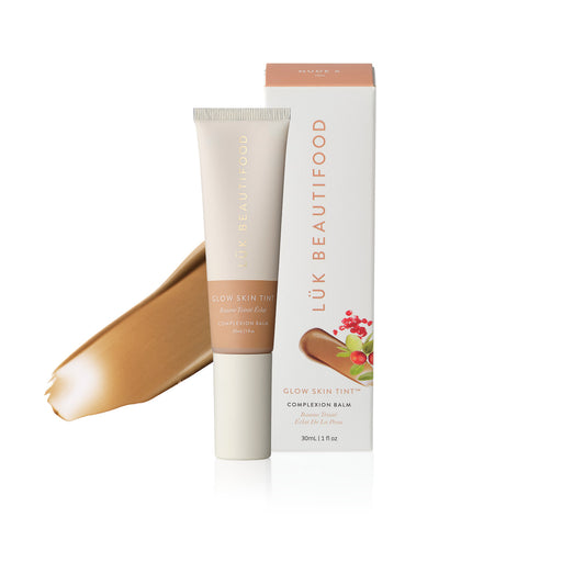 LÜK Beautifood Instant Glow Skin Tint in Nude 6 Tan, tube and box with a swatch of the tinted complexion balm