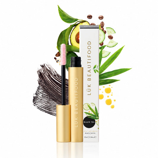 Lük Beautifood Lash Nourish natural mascara in Black Tea, inky black swatch and pink hourglass brush, with avocado, cucumber and coffee beans