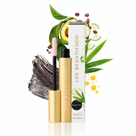 Lük Beautifood Lash Nourish natural mascara in Black Tea, inky black swatch and pink hourglass brush, with avocado, cucumber and coffee beans