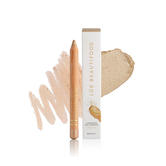 Lük Beautifood Luminous Eye Crayon in Champagne, a warm honey gold, shown with swatch