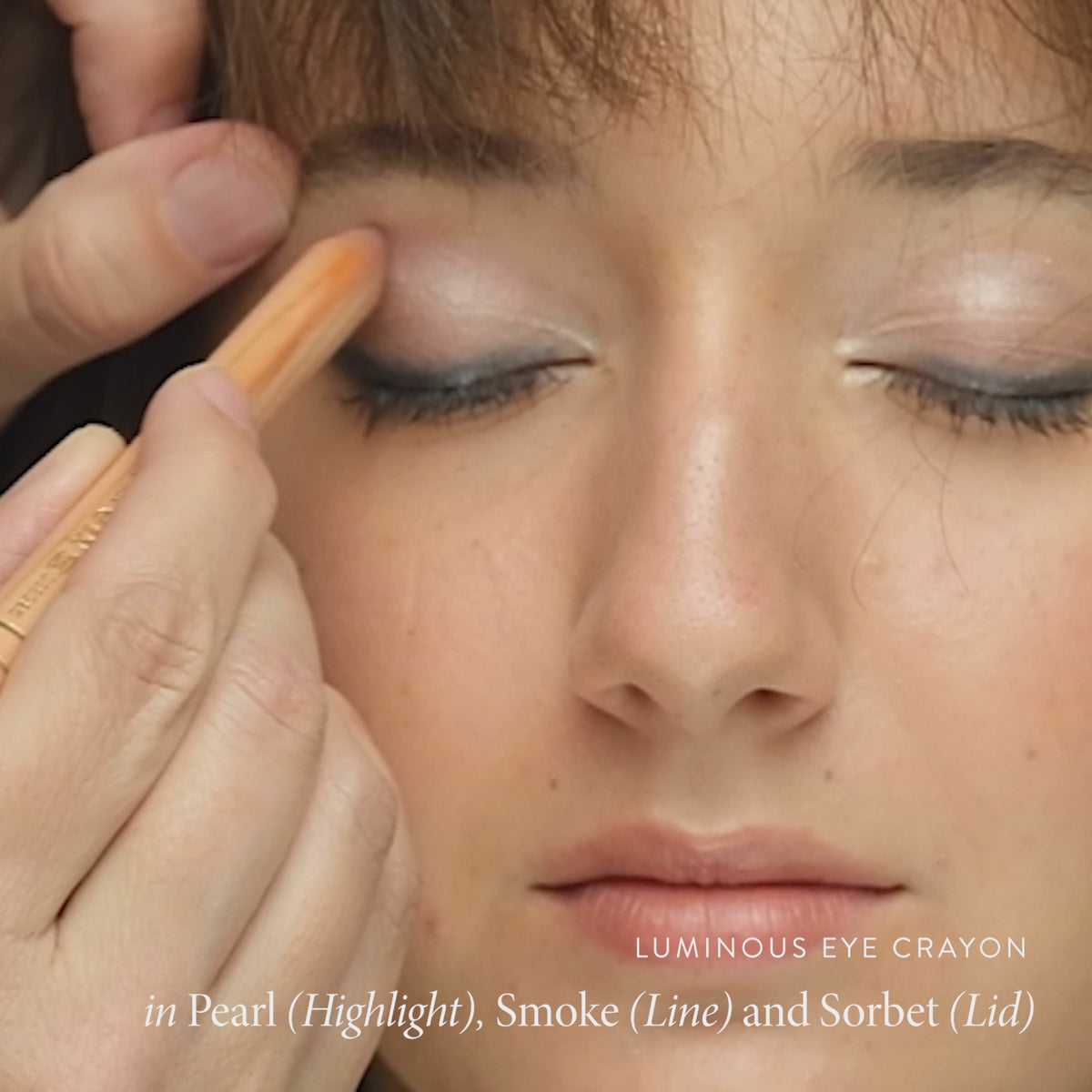 Model wearing Lük Beautifood Luminous Eye Crayon in Smoke and Sorbet — natural metallic eyeshadow crayon applied for a soft smoky eye