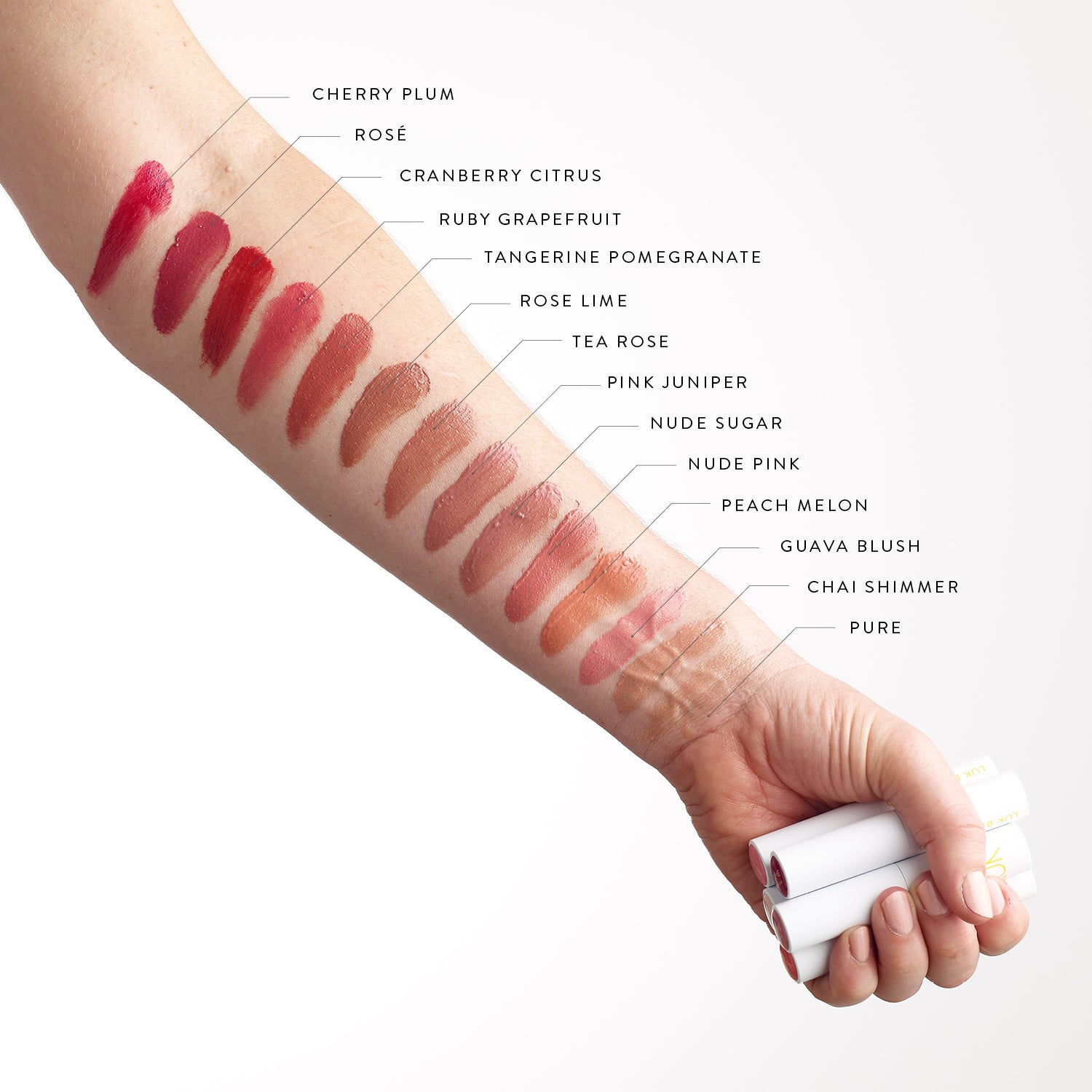Lük Beautifood Lip Nourish Natural Lipstick in 14 sheer and buildable shades. Shade swatches on arm