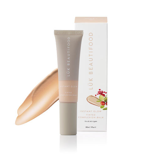 LÜK Beautifood Instant Glow Skin Tint in Nude 1 Fair, tube and box with a swatch of the tinted complexion balm